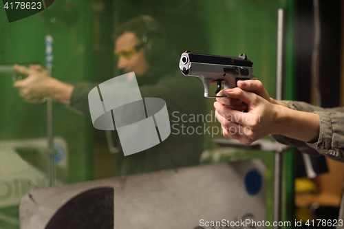 Image of The man at the shooting range. Science use of firearms.