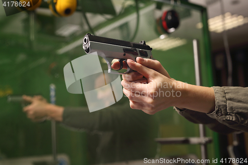 Image of Shooting a gun at shooting range