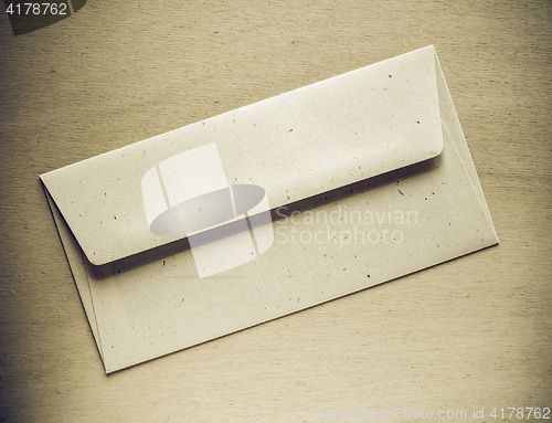 Image of Vintage looking Letter envelope on wood table