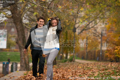 Image of Happy young Couple in Autumn Park