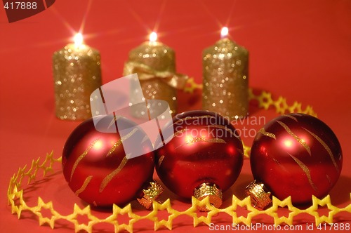 Image of Gold candles and red glass balls