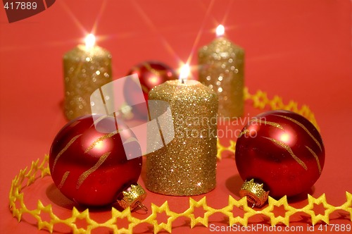 Image of Gold candles and red glass balls