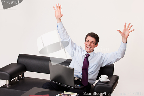 Image of Young Emotional Man In A Business Suit