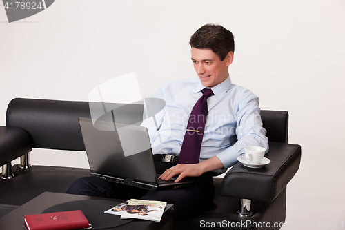 Image of Young Emotional Man In A Business Suit