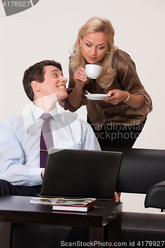 Image of Young Woman And Man with a notebook