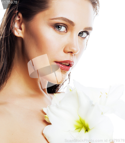 Image of young pretty woman with  Amarilis flower close up isolated on wh
