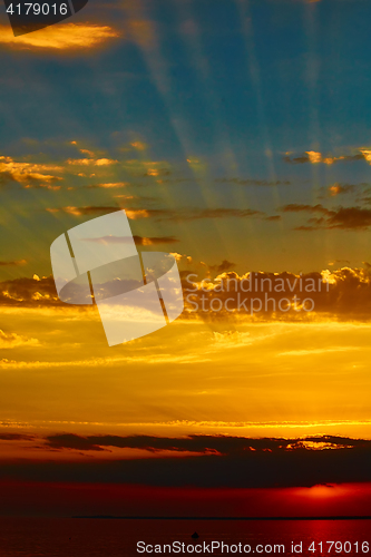 Image of good red sunset over darken sea