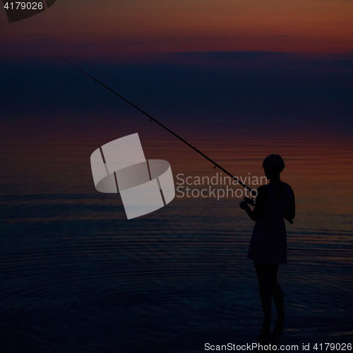 Image of Fishing Silhouette on dramatic sky and sea