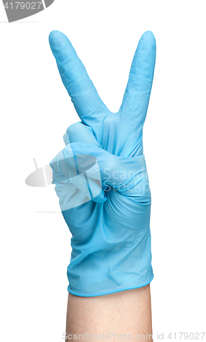 Image of Hand in blue latex glove showing two fingers