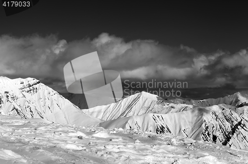 Image of Black and white view on ski slope and beautiful snowy mountains 