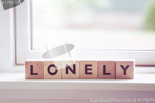 Image of Lonely sign in a bright window