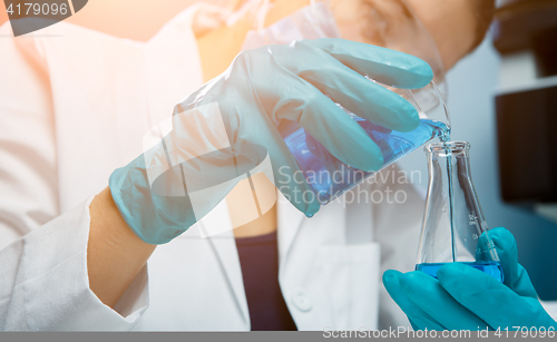 Image of Girl conducts experiments with bulb