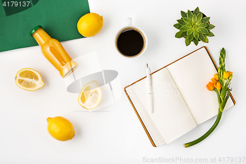 Image of Top view of white office female workspace with notebook