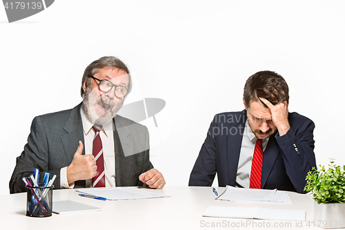 Image of The two colleagues working together at office on white background.