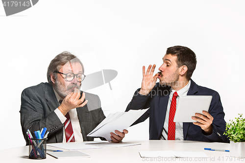 Image of The two colleagues working together at office on white background.