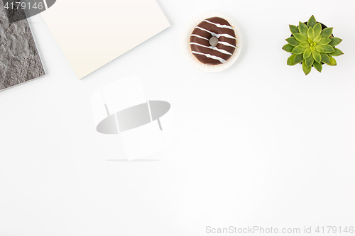 Image of Top view of white office female workspace with notebook