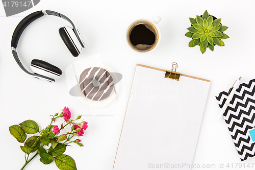 Image of Top view of white office female workspace with notebook