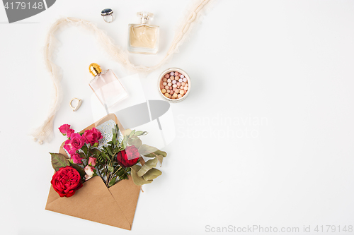 Image of Love or valentine\'s day concept. Red beautiful roses in envelopen