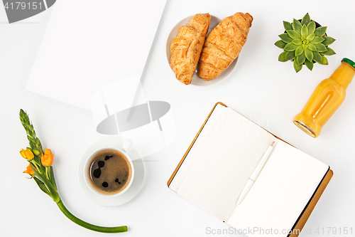 Image of Top view of white office female workspace with notebook