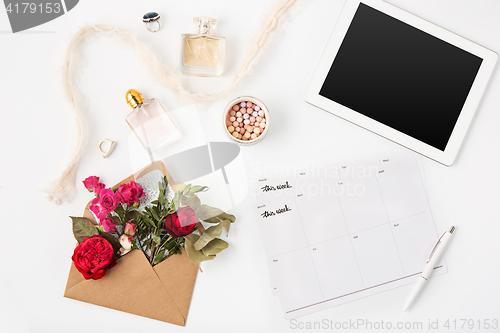 Image of Top view of white office female workspace with laptop