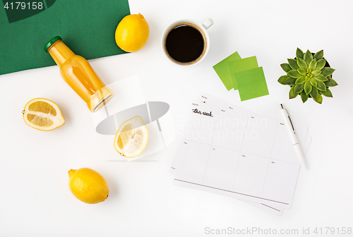 Image of Top view of white office female workspace with notebook