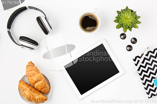 Image of Top view of white office female workspace with laptop