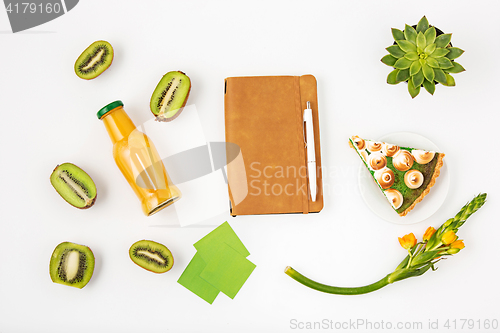 Image of Top view of white office female workspace with notebook