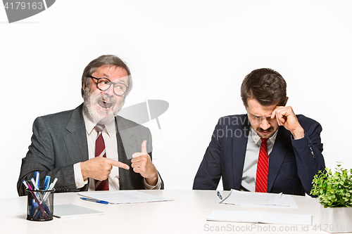 Image of The two colleagues working together at office on white background.