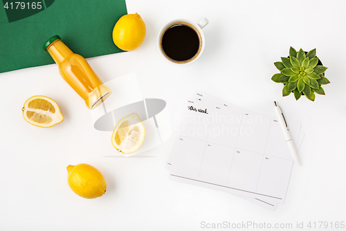 Image of Top view of white office female workspace with notebook