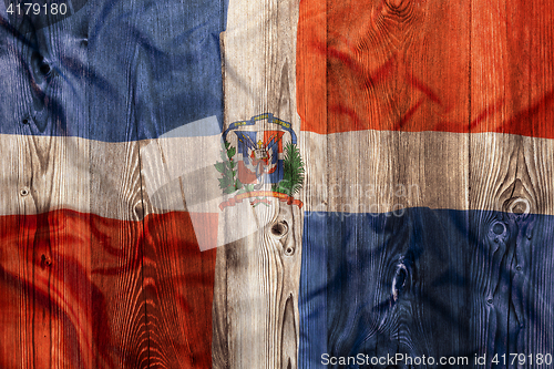 Image of National flag of Dominican Republic, wooden background