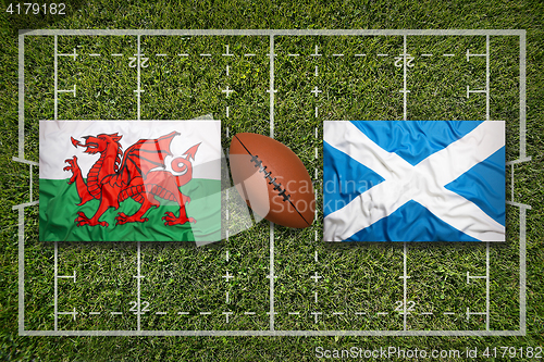 Image of Wales vs. Scotland flags on rugby field