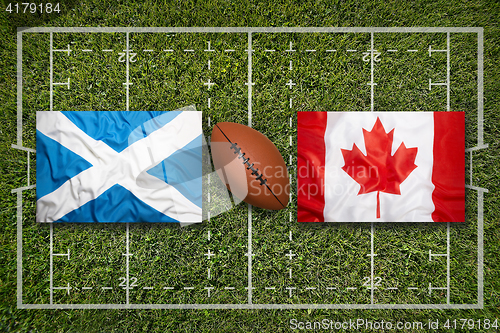 Image of Scotland vs. Canada flags on rugby field