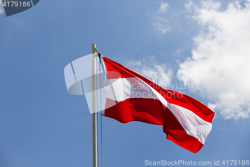 Image of National flag of Austria on a flagpole