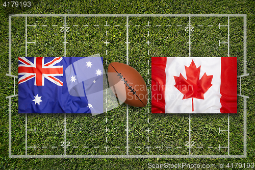 Image of Australia vs. Canada\r flags on rugby field