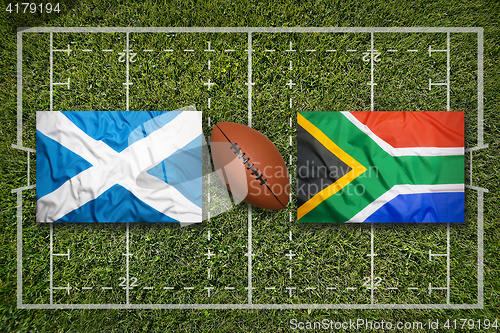 Image of Scotland vs. South Africa flags on rugby field