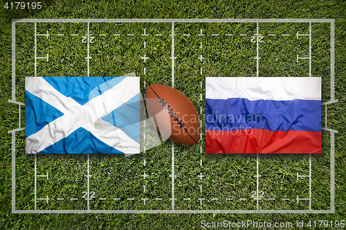 Image of Scotland vs. Russia flags on rugby field