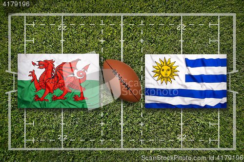 Image of Wales vs. Uruguay flags on rugby field