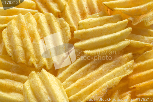 Image of Background from appetizing corrugated potato chips