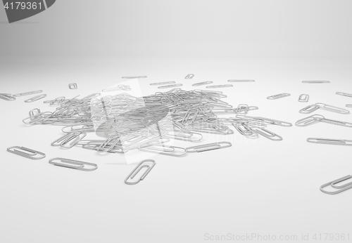 Image of many paperclips on desk