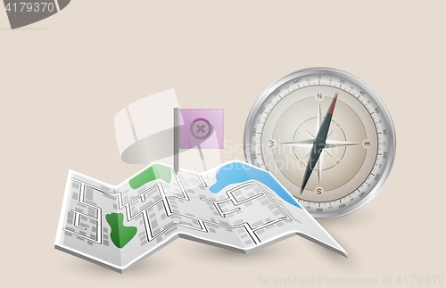 Image of folded paper map with pointer flag and compass