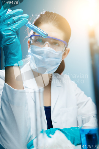 Image of Lab technician experiments with reagents