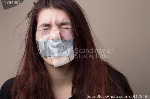 Image of Girl with tape on face