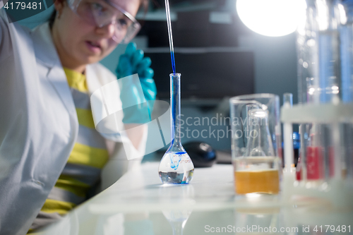 Image of Lab technician in protective glasses