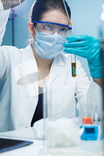 Image of Young woman carries out tests