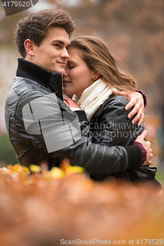 Image of Autumn portrait of attractive happy couple