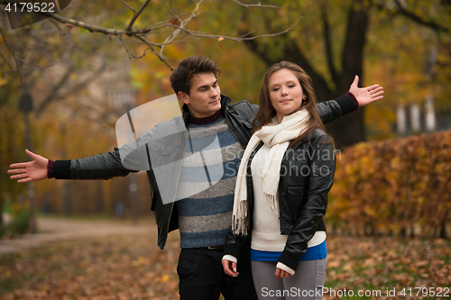 Image of Happy young Couple in Autumn Park