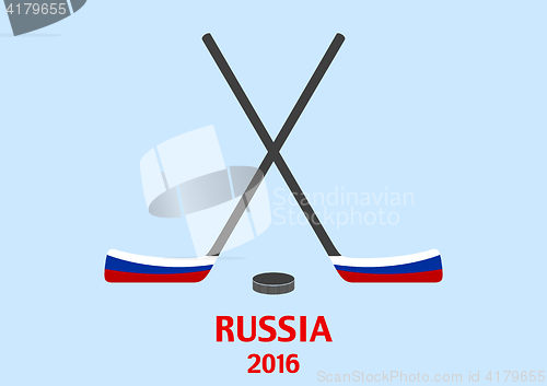 Image of Hockey sticks and puck with the Russian flag