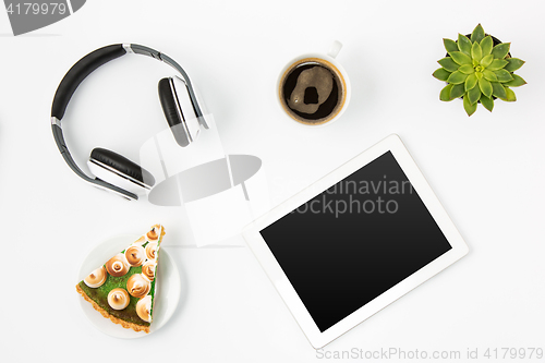 Image of Top view of white office female workspace with laptop