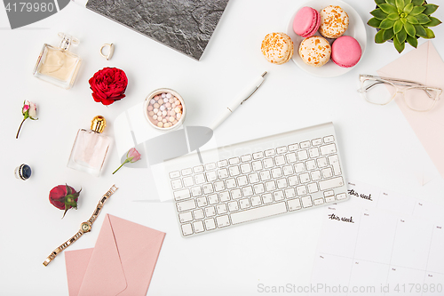 Image of Top view of white office female workspace with pc