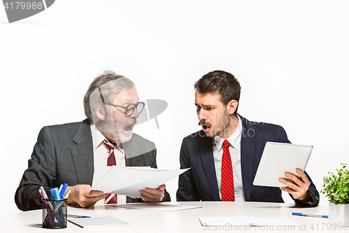 Image of The two colleagues working together at office on white background.